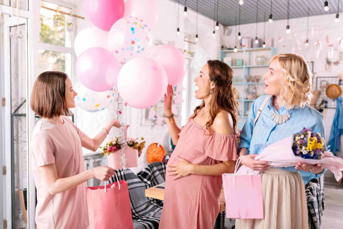 three women celebrating baby shower