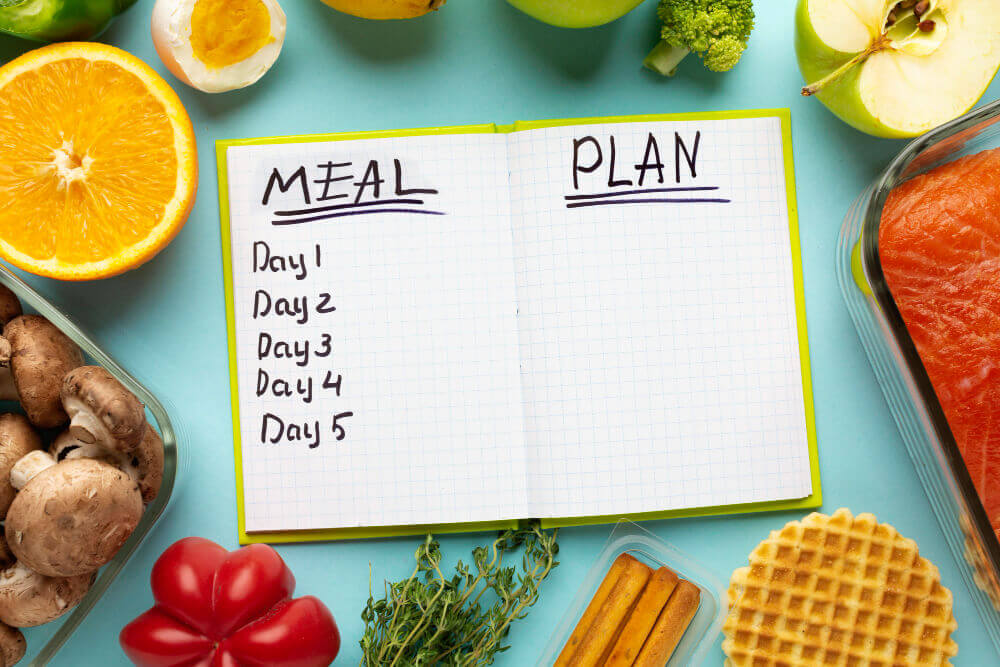 top view arrangement with meal planning notebook