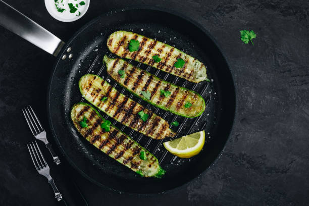 Grilled zucchini slices in cast iron pan