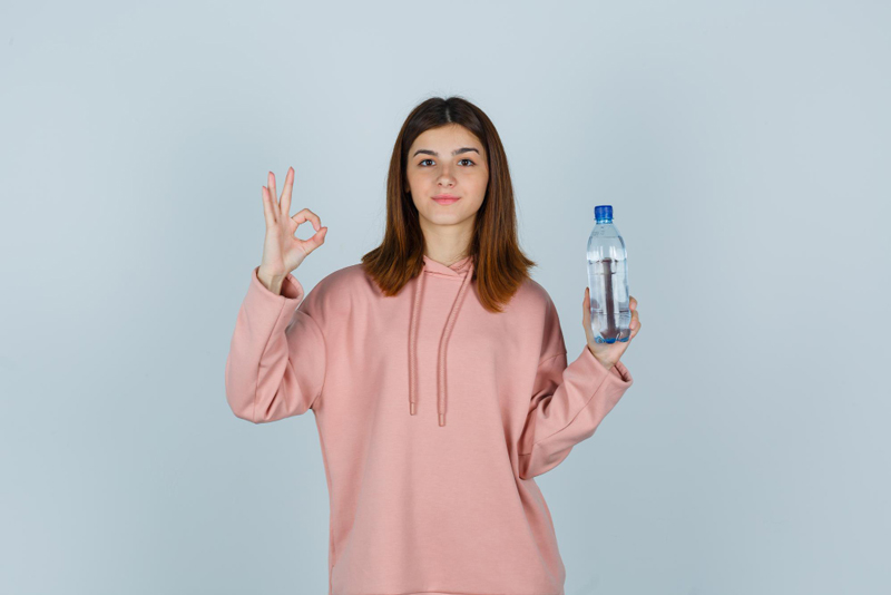 girl holding water bottle